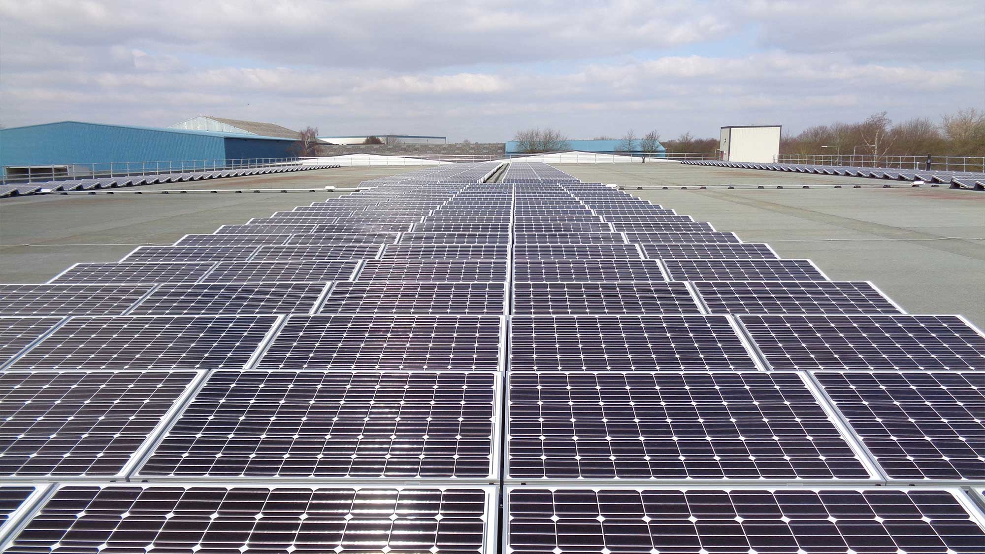 Rooftop with Array of solar panels installed on bauder reinforced bituminous waterproofing system