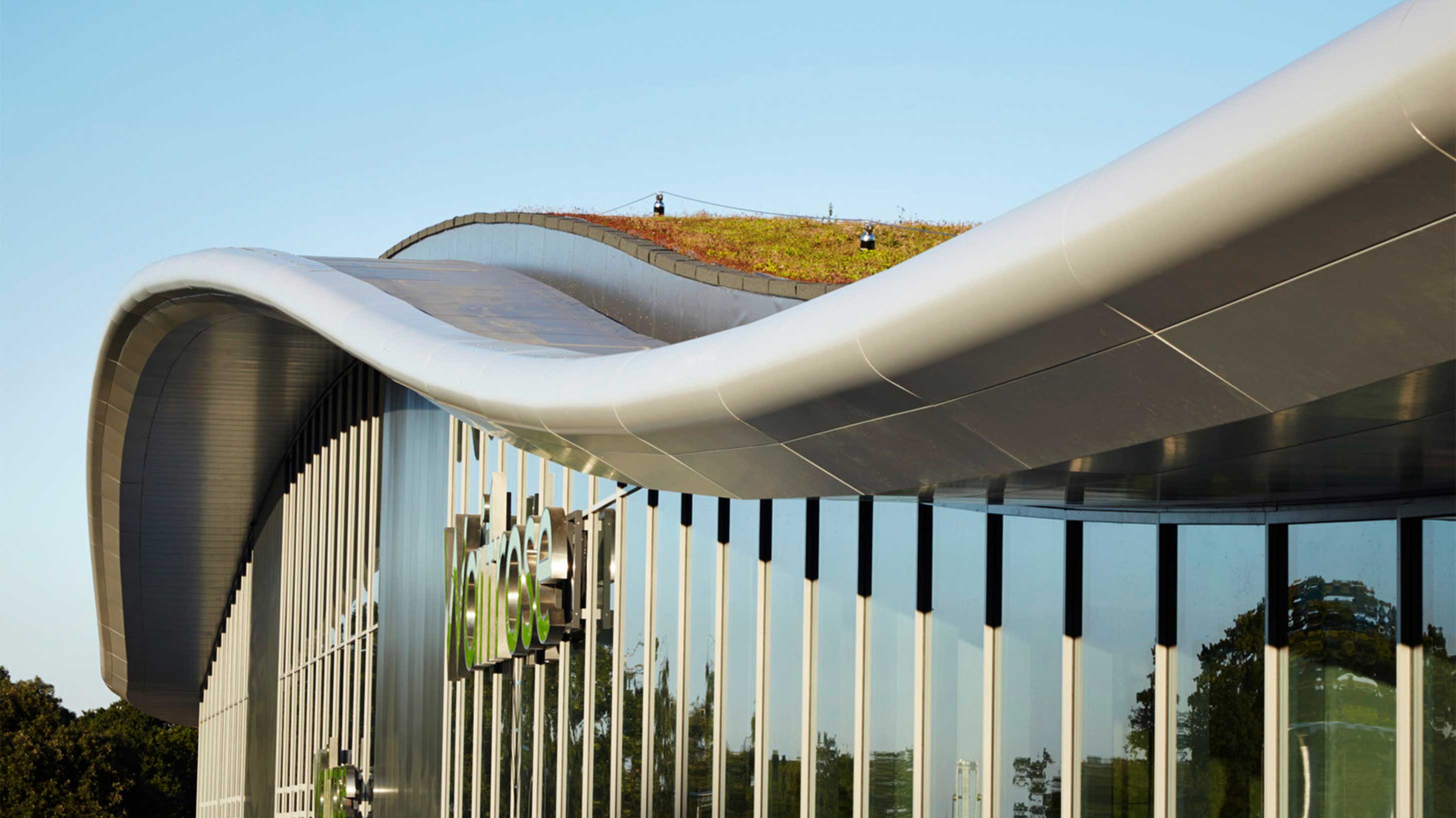 Modern architectural building with green roof to provide environmental benefits