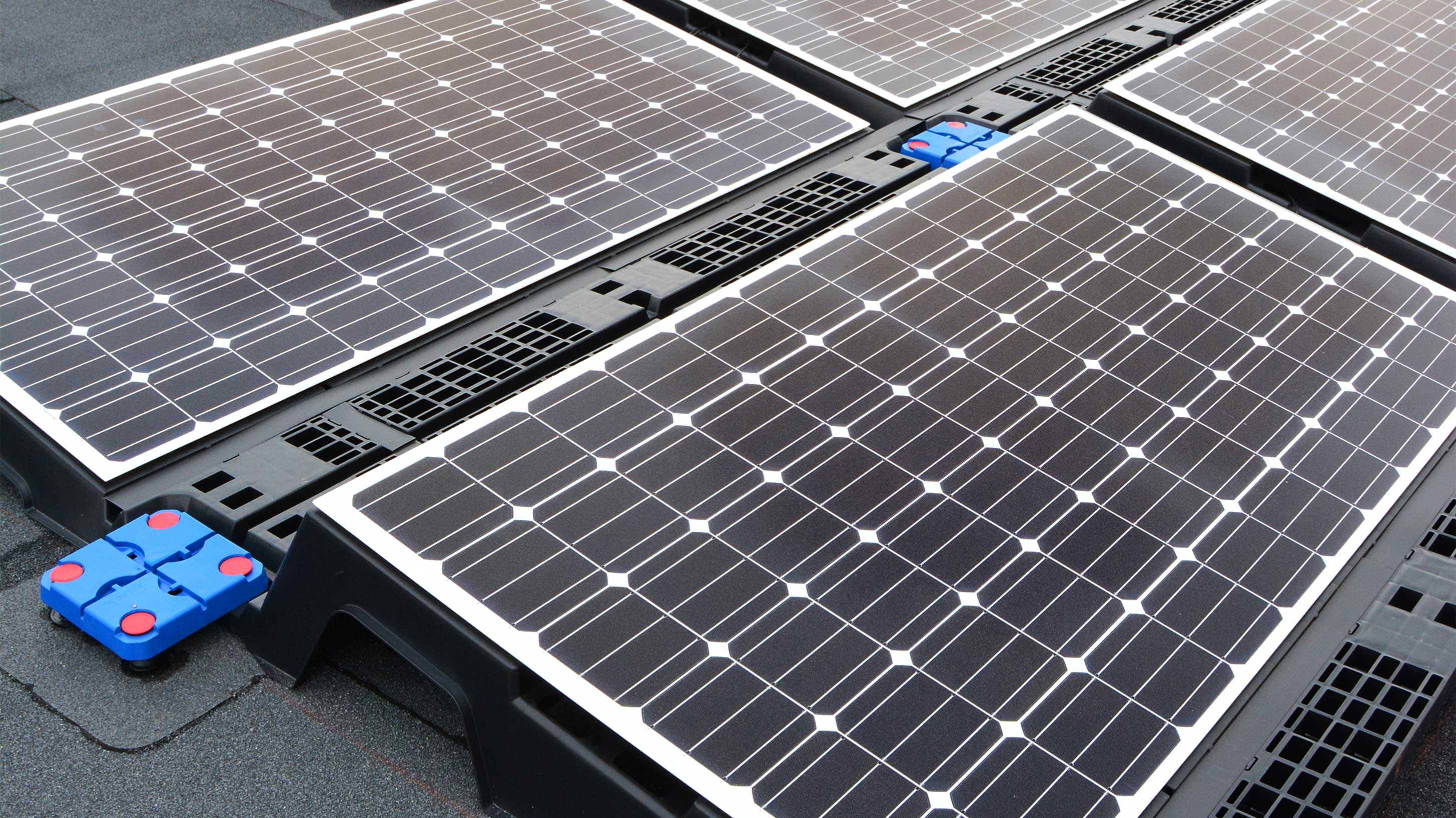 Roof of JCB World Headquarters with array of solar panels installed on Bauder Total Roof System