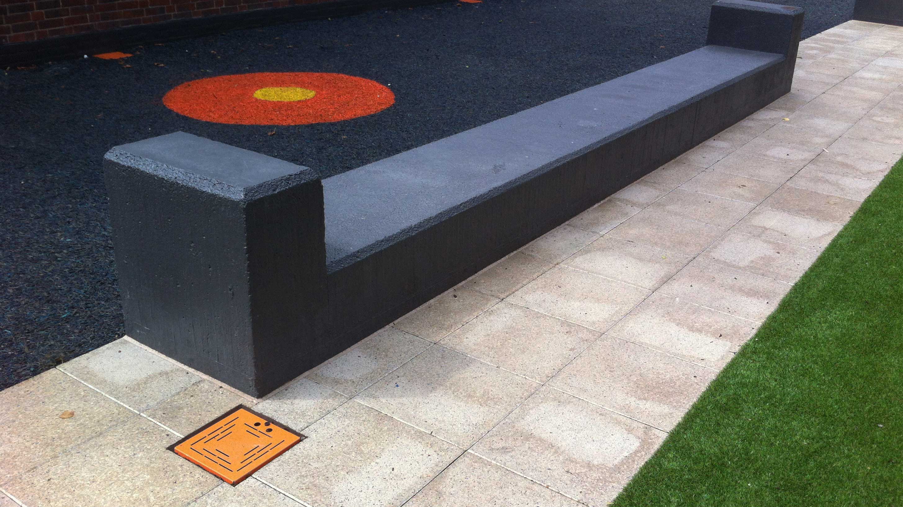 Drainage solution near a soft play area with seating bench