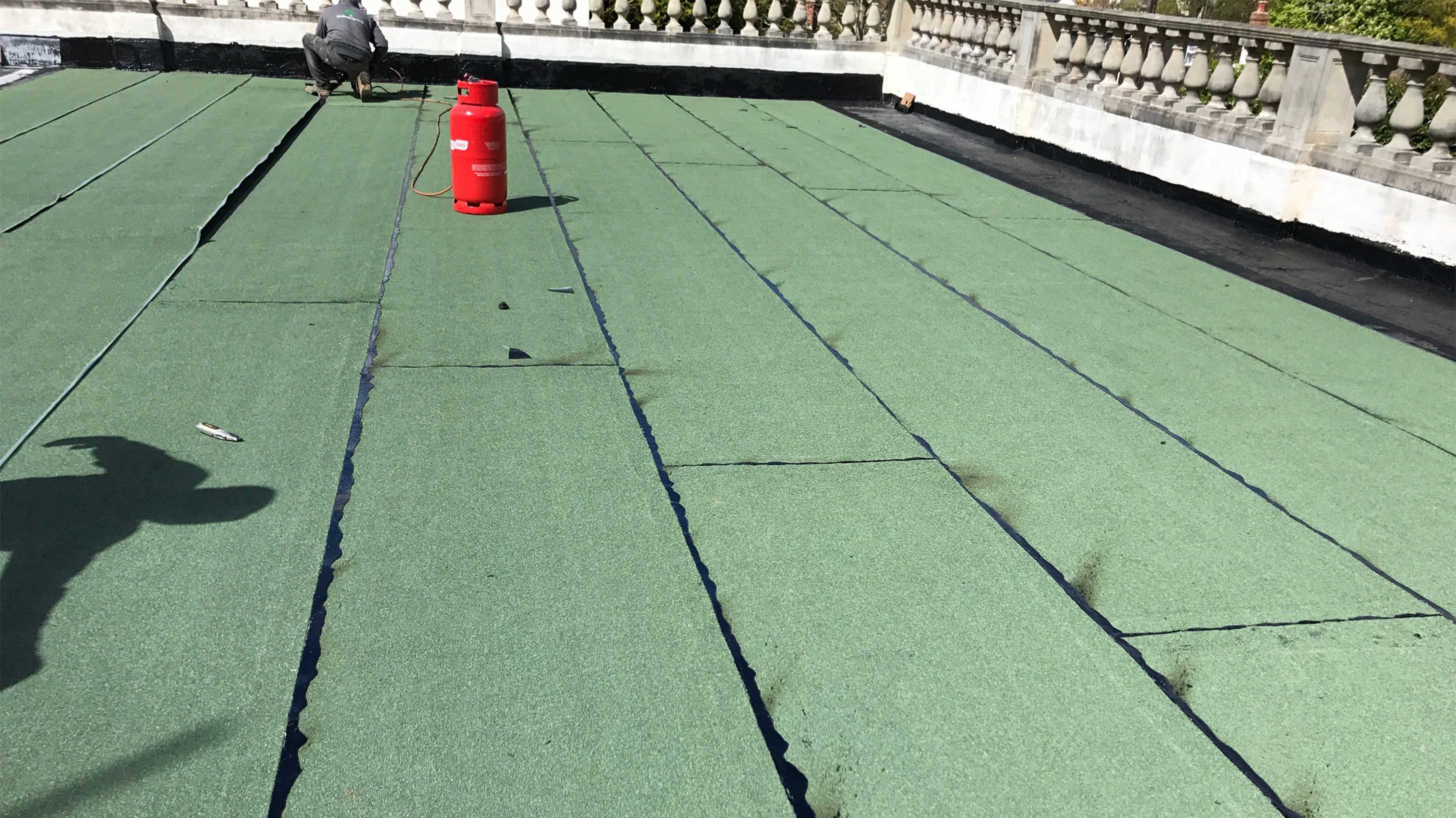 Belvedere court roof installation in progress with Bauder Hot Melt Structural Waterproofing System