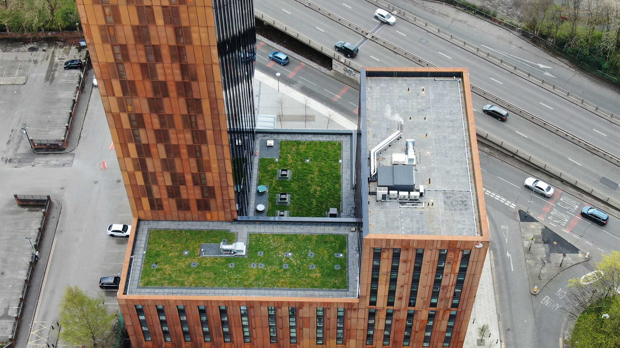 Aerial view of River Street Tower with Bauder Bakor Hot Melt structural waterproofing system with mixed landscaping