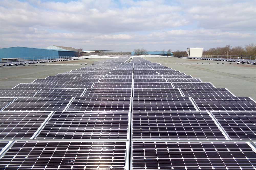Rooftop with Array of solar panels installed on bauder reinforced bituminous waterproofing system