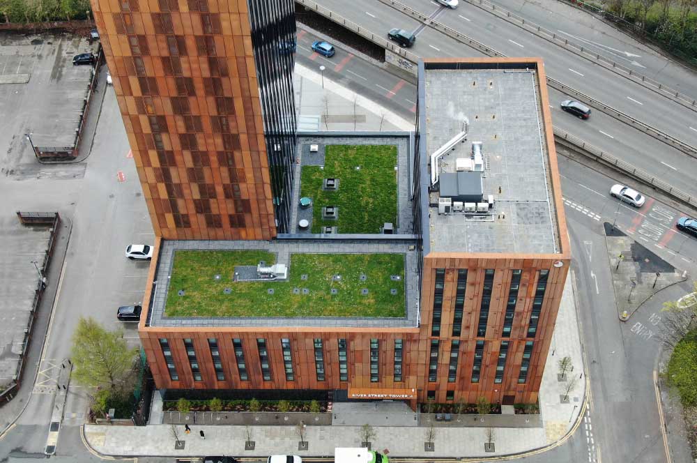 Aerial view of River Street Tower with Bauder Bakor Hot Melt structural waterproofing system with mixed landscaping