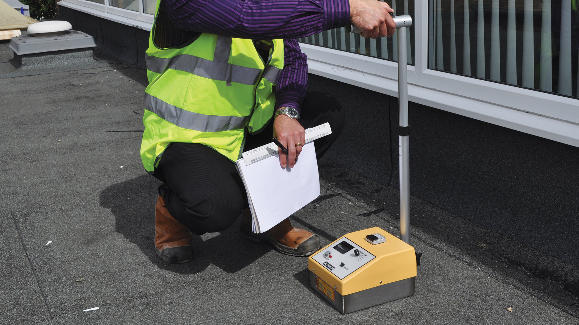 Technician in process of moisture mapping