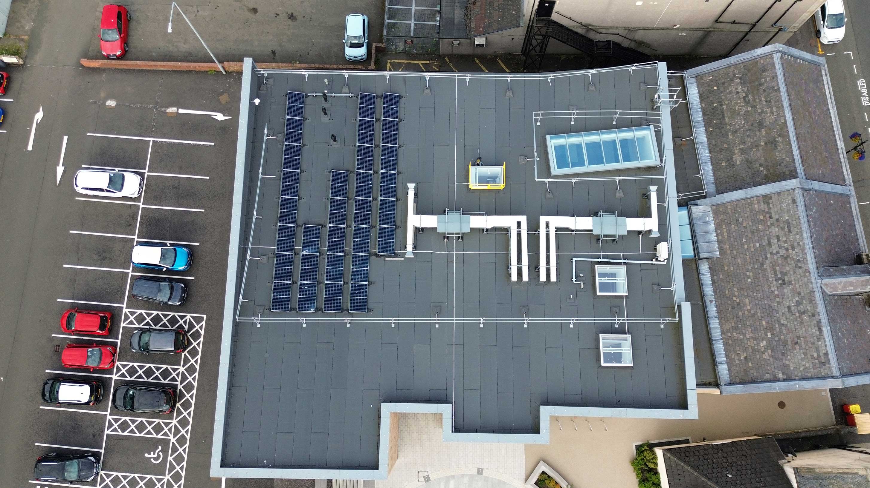 Whitburn Partnership Centre rooftop with array of solar panels on Bauder total roof system