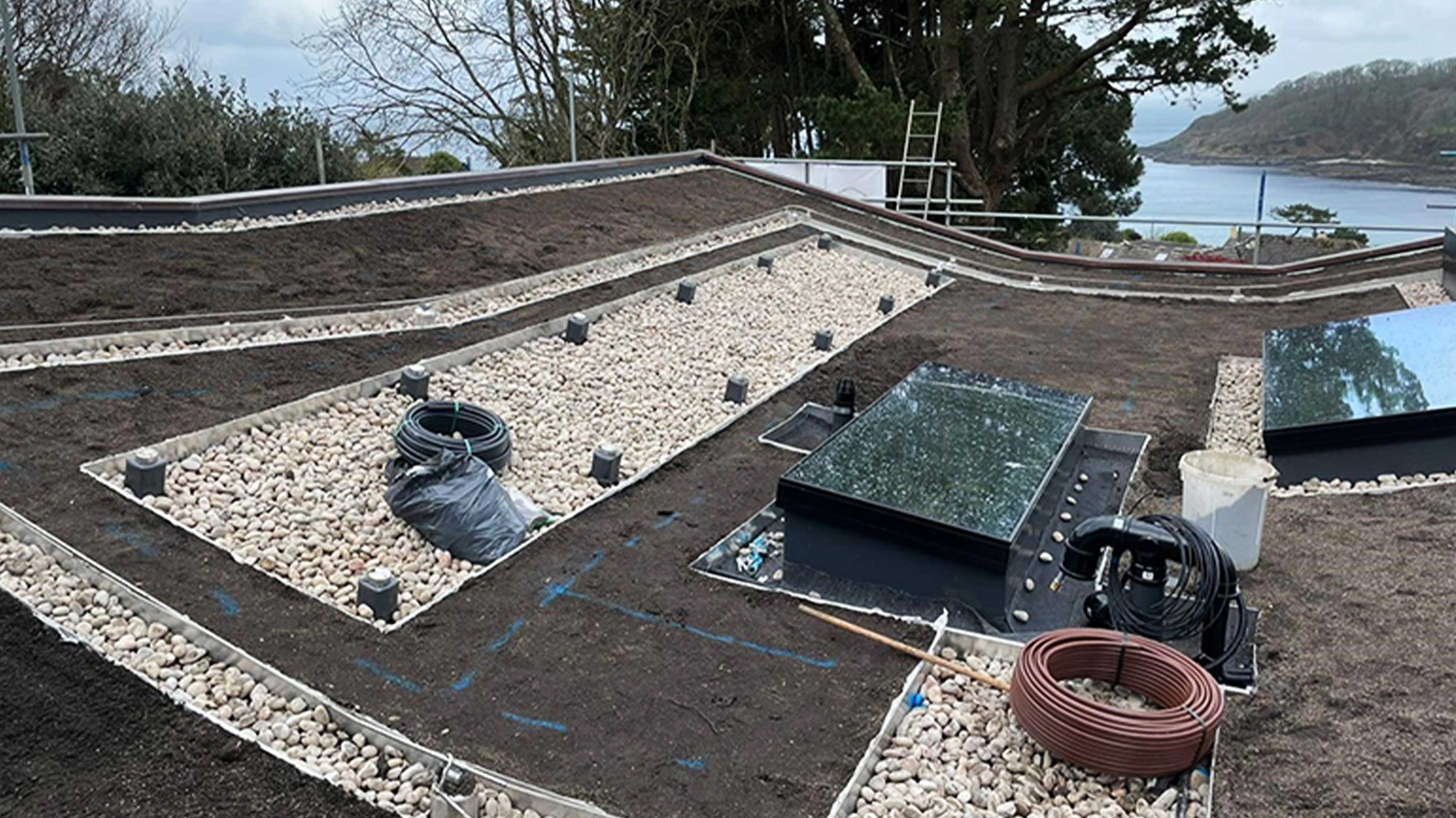 Rooftop of modern building with solar panels under construction