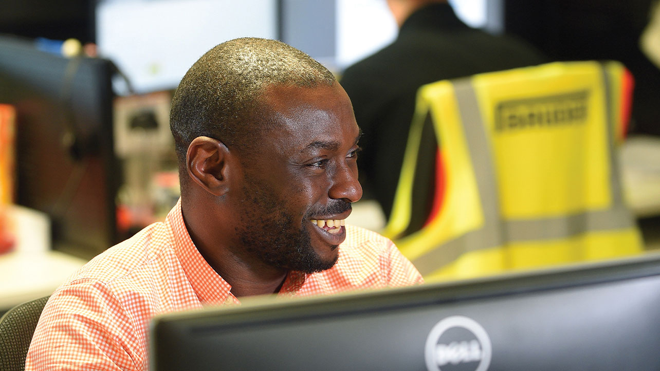man working on detailed computer design