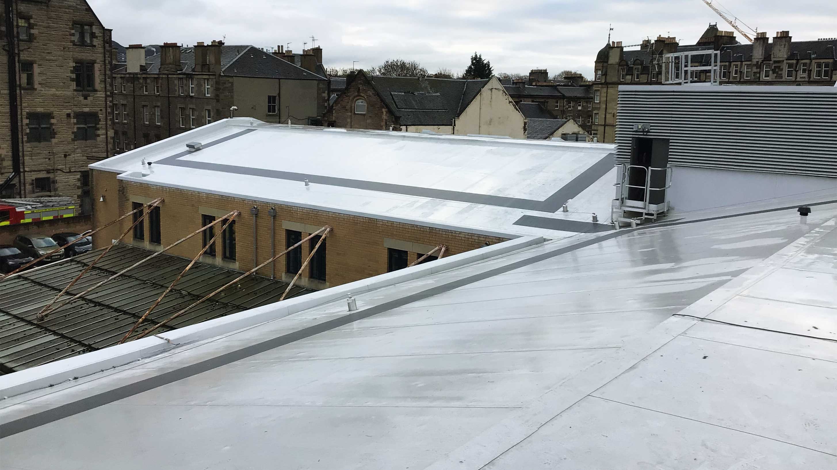 Roof of Tollcross Fire Station with Bauder Thermofol PVC single ply waterproofing with Profiled PIR Infill Overlay System