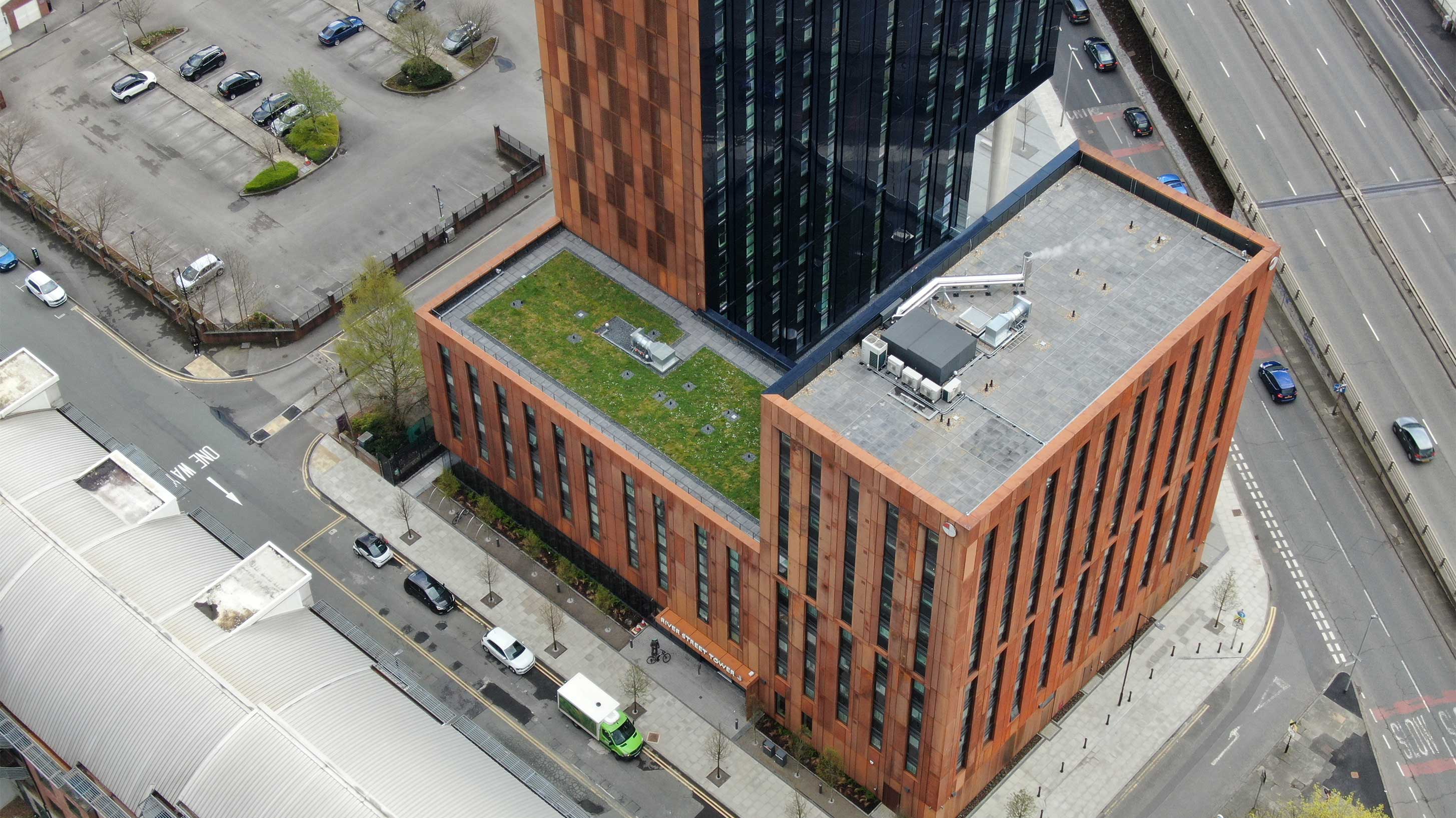 Aerial view of River Street Tower with Bauder Bakor Hot Melt structural waterproofing system with mixed landscaping