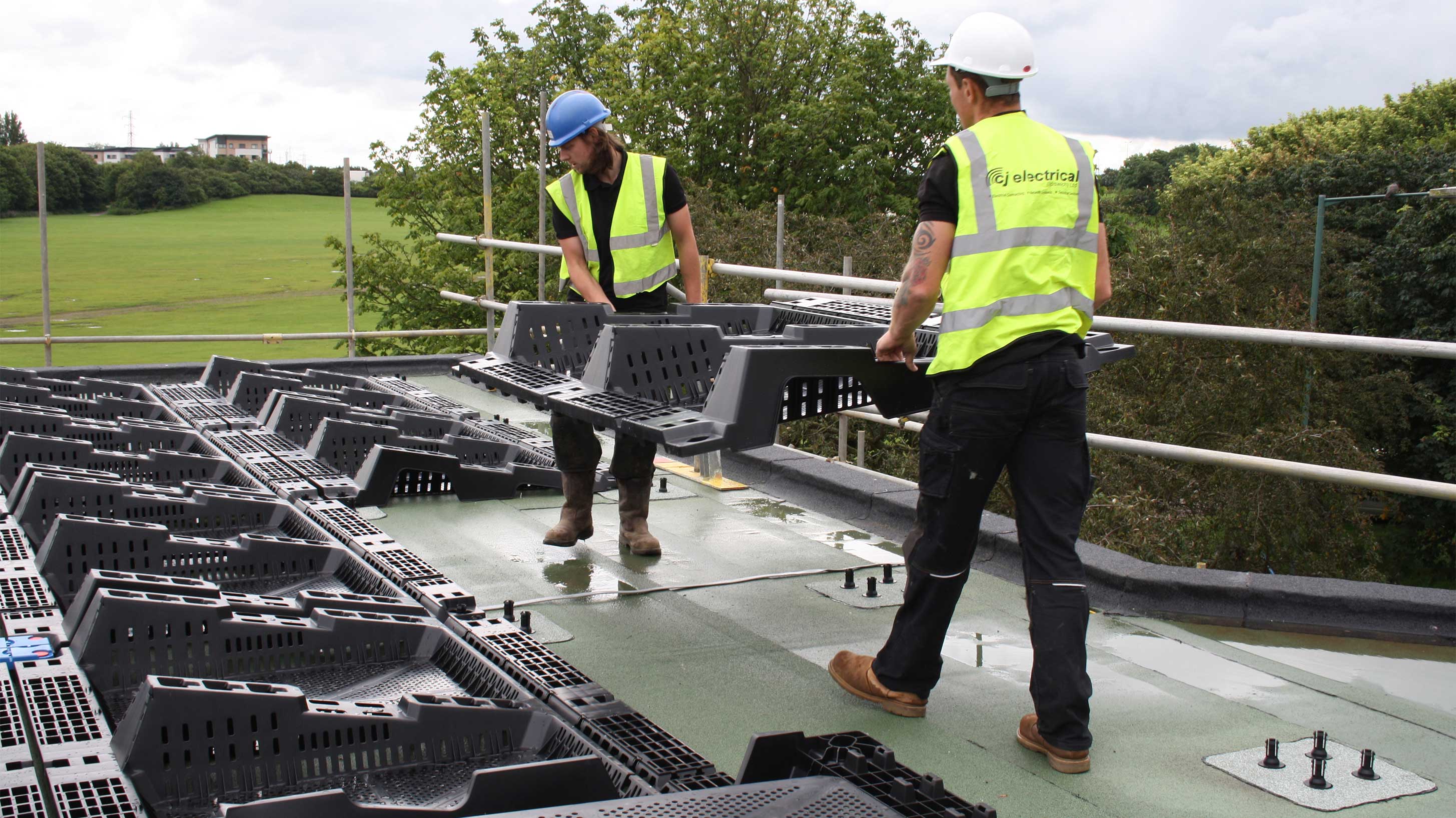 Key Theatre, a modern building with solar panels being installed