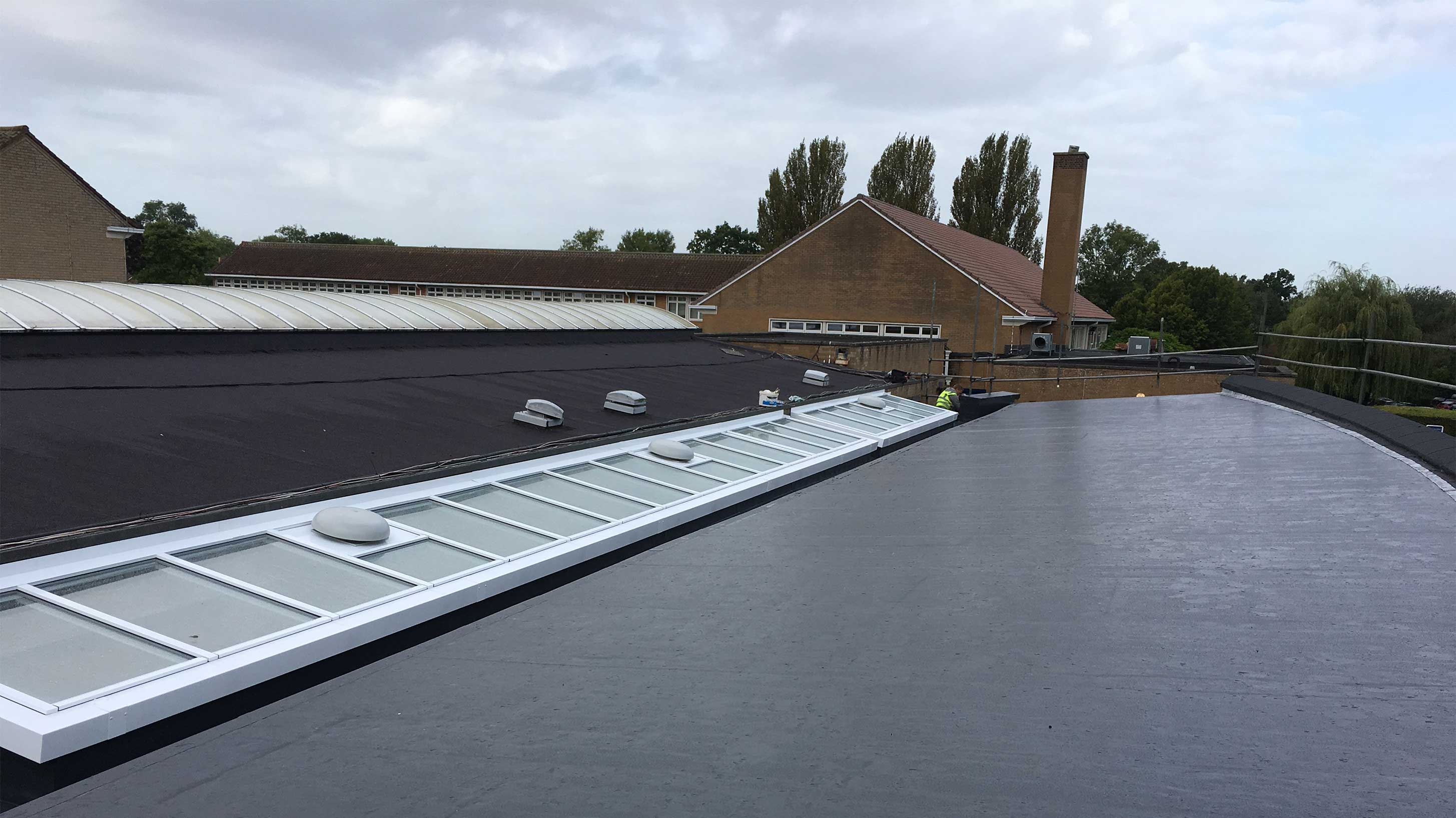 Roof of George Abbott School with Bauder Thermofol single ply waterproofing system installed with Bauder Euroglaze rooflights