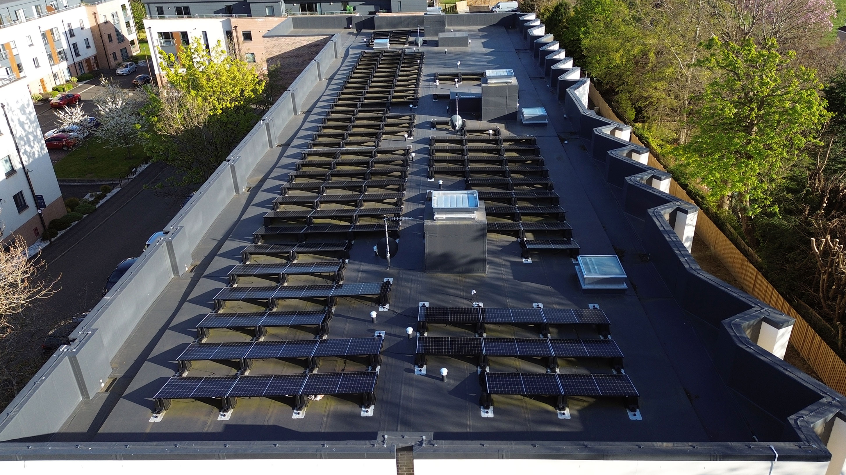 Aerial view of Pinkhill Gate roof with BauderThermofol PVC single ply waterproofing system and Solar PVs