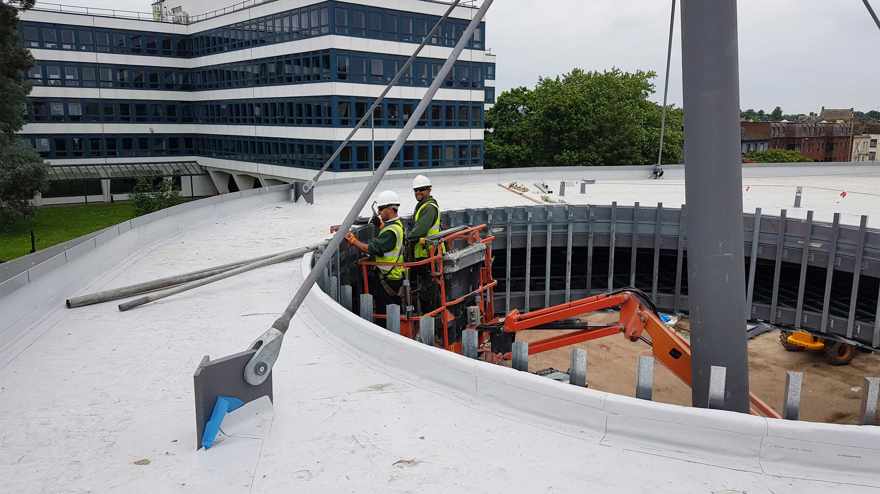 Gloucester Transport Hub with roofing workers