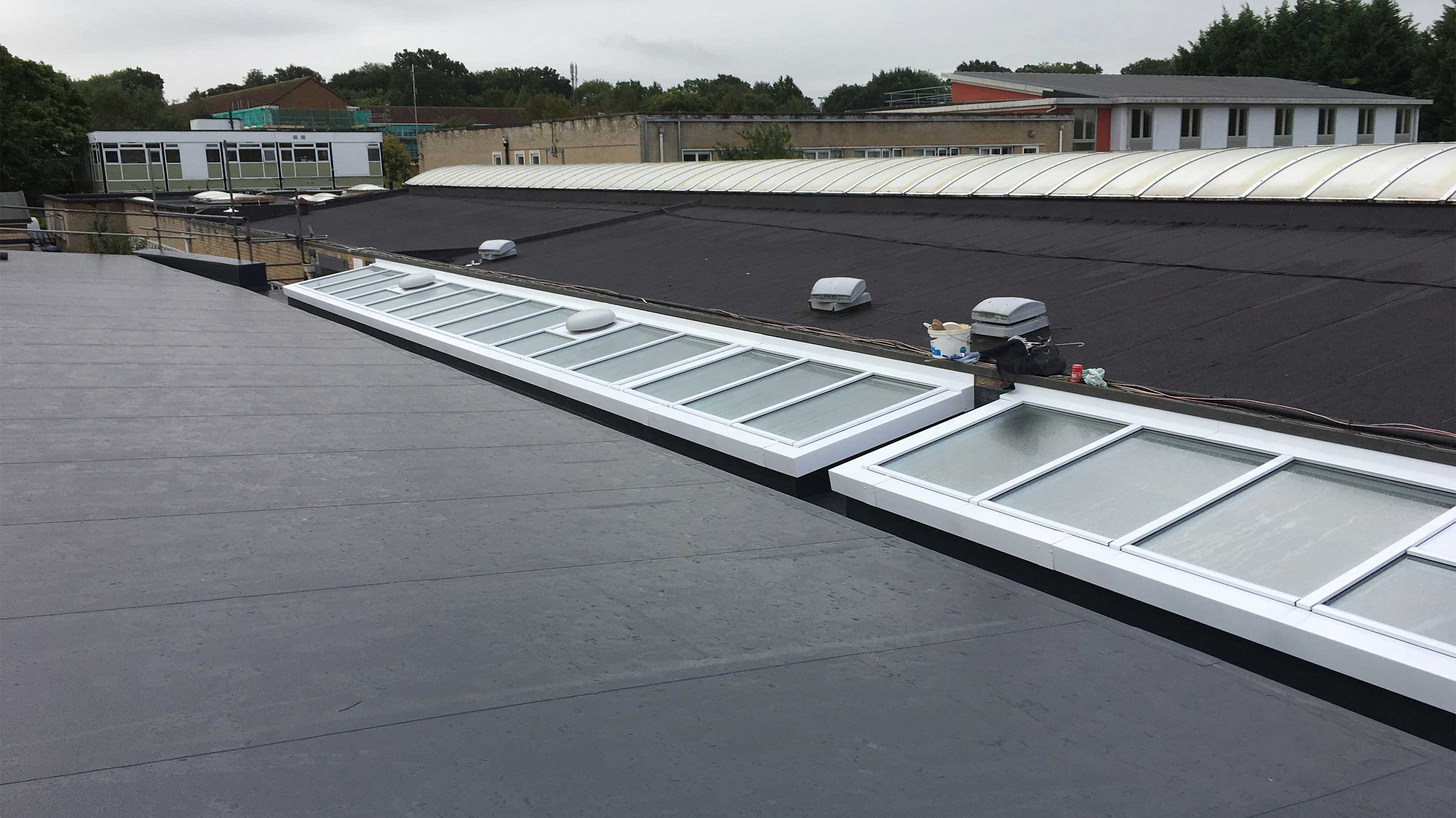 Roof of George Abbott School with Bauder Thermofol single ply waterproofing system installed with Bauder Euroglaze rooflights