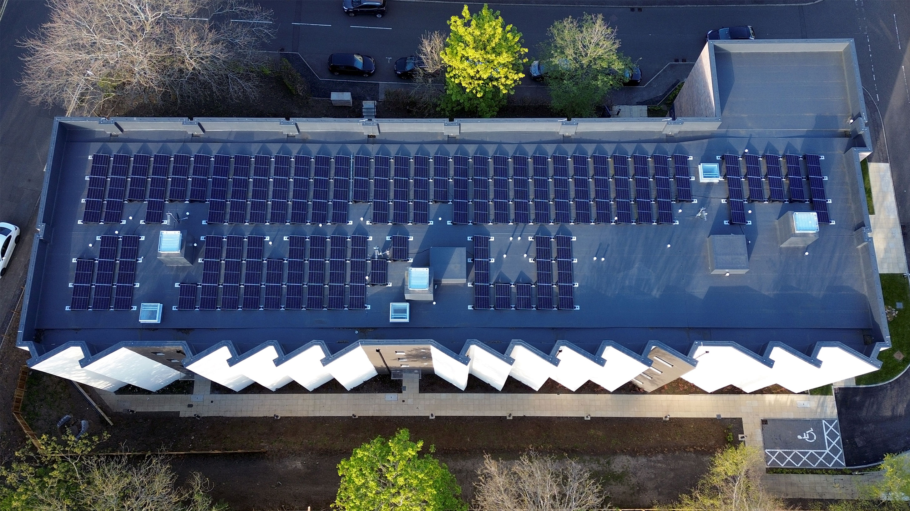 Aerial view of Pinkhill Gate roof with BauderThermofol PVC single ply waterproofing system and Solar PVs