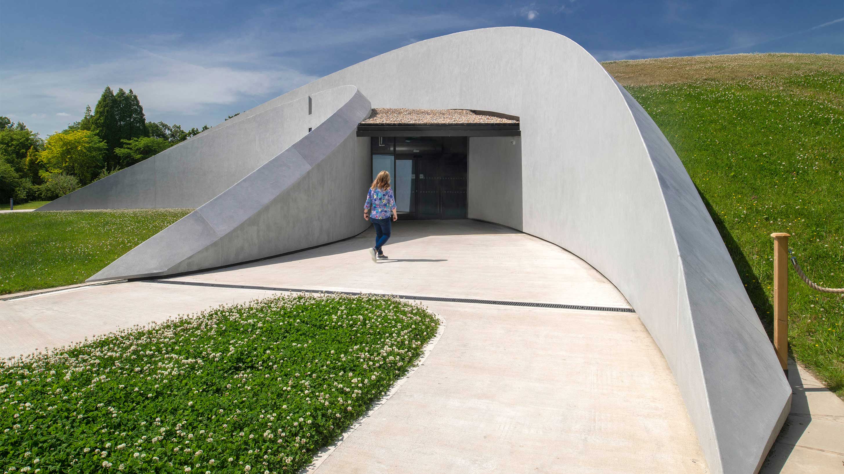 First Light Pavilion with woman walking  towards entrance