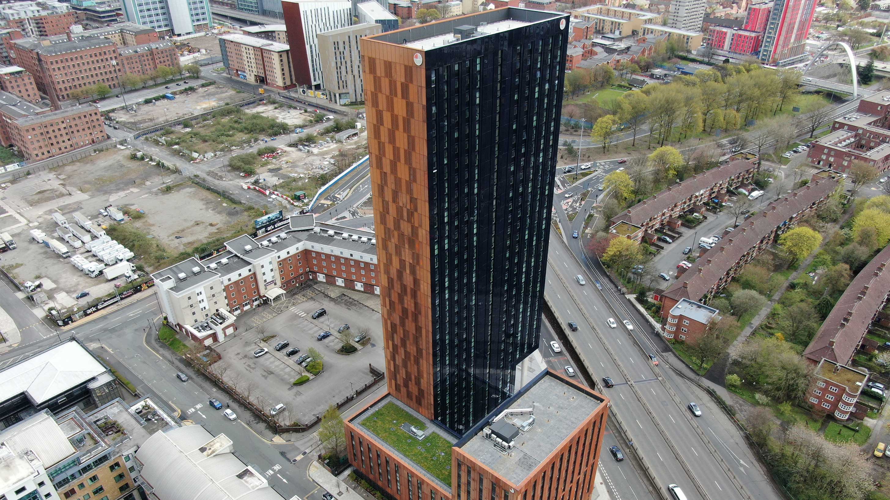 Aerial view of River Street Tower with Bauder Bakor Hot Melt structural waterproofing system with mixed landscaping