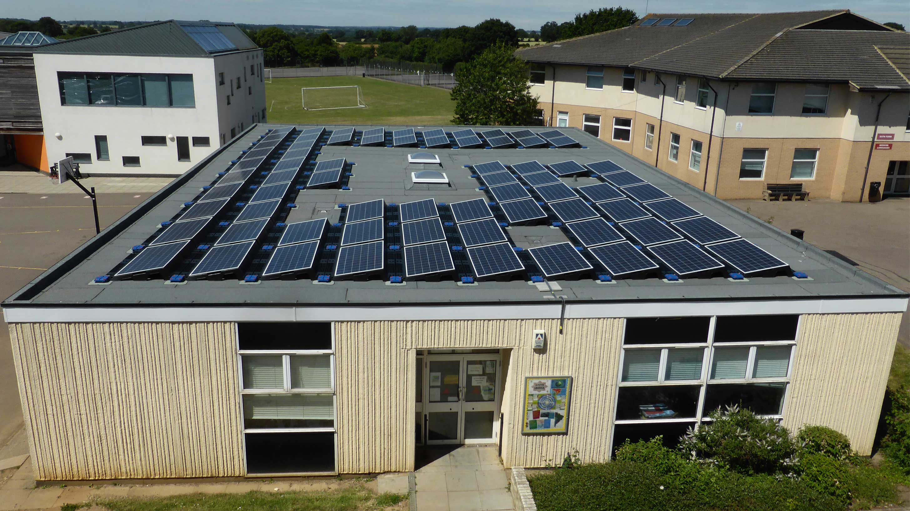 Roundwood Park School roof with Bauderflex bituminous system with BauderSOLAR and Bauder rooflights