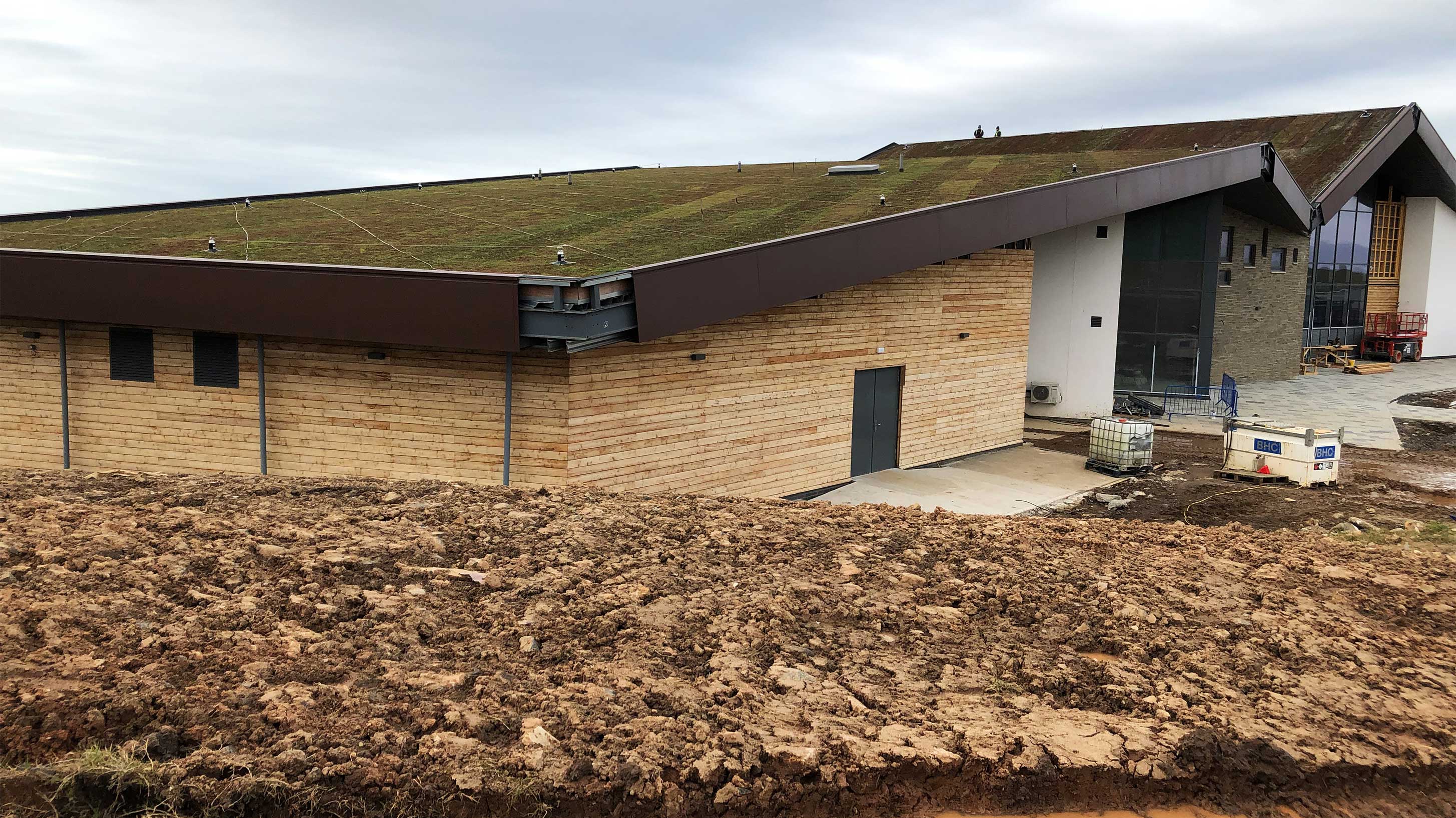 Rear view of Lagg Distillery in Scotland with Bauder Total Green Roof System installed