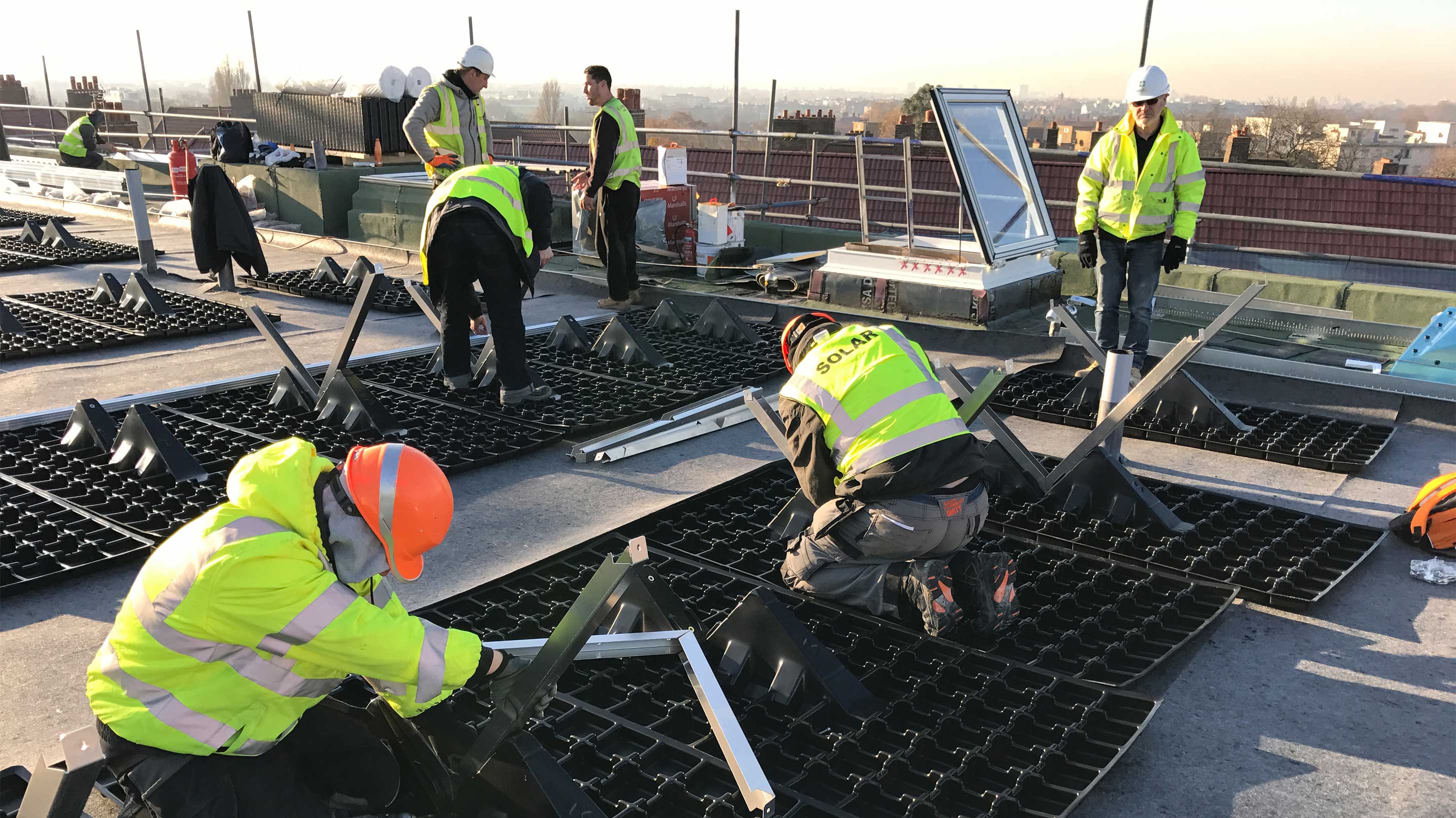 Clapham Park with Bauder Solar being installed by workers