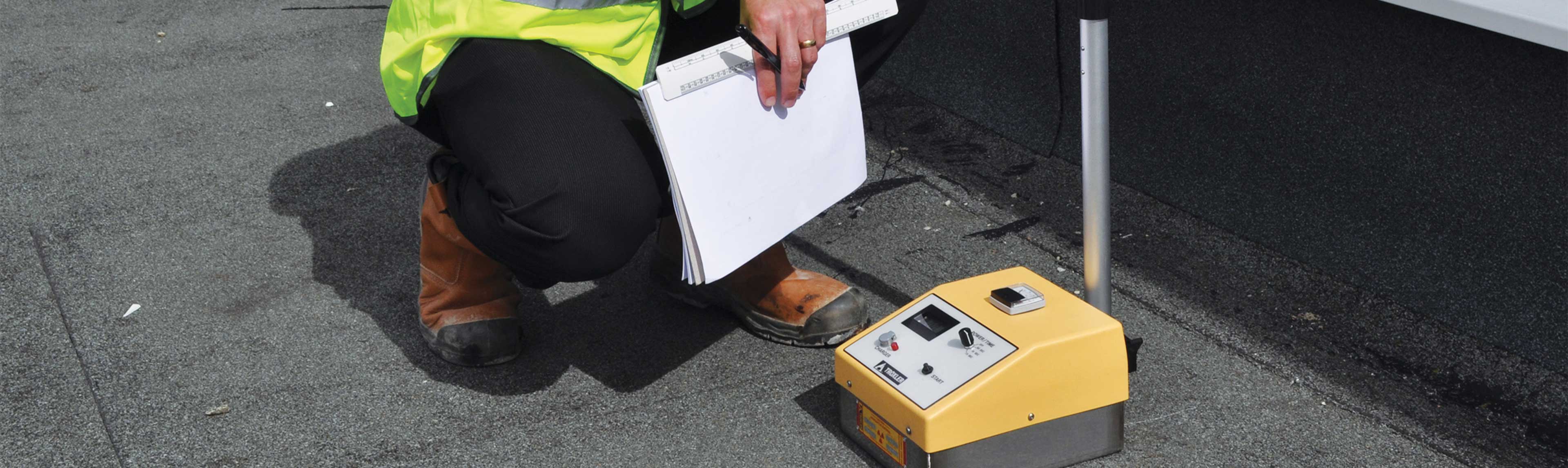 Technician in process of moisture mapping