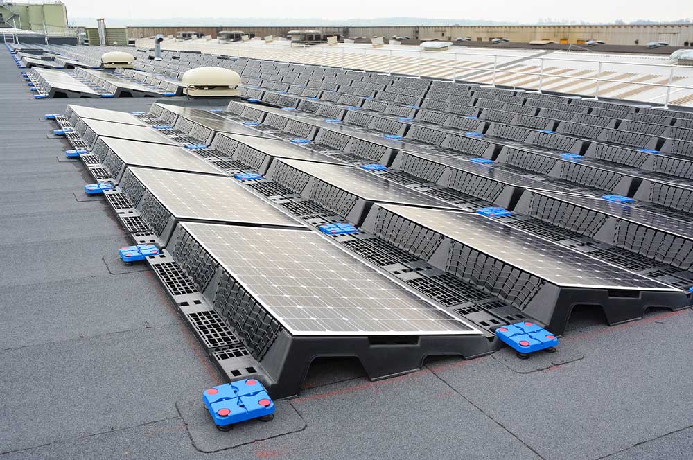 Roof of JCB World Headquarters with array of solar panels installed on Bauder Total Roof System