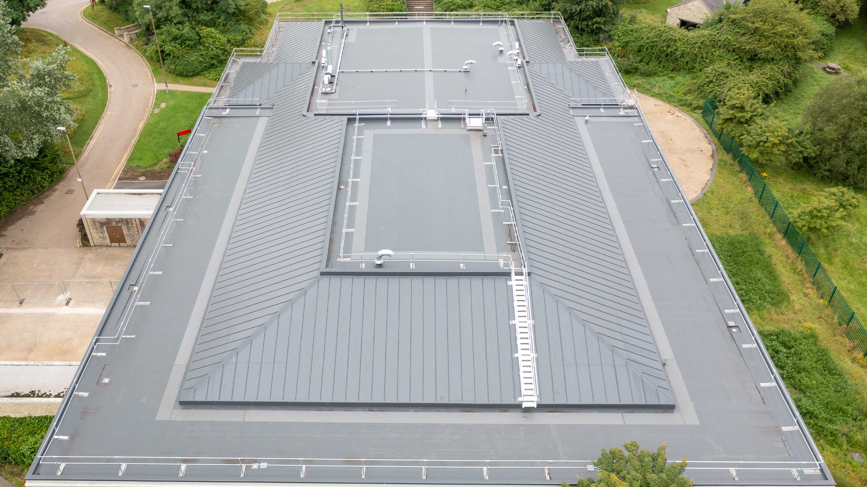 BauderThermofol PVC single ply system with profiled infill overlay system shown on University of West England W Block
