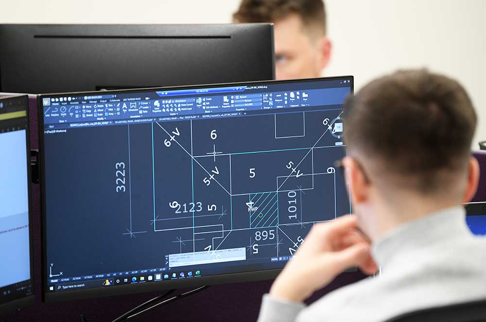 Flat roof Technician working on a digital design