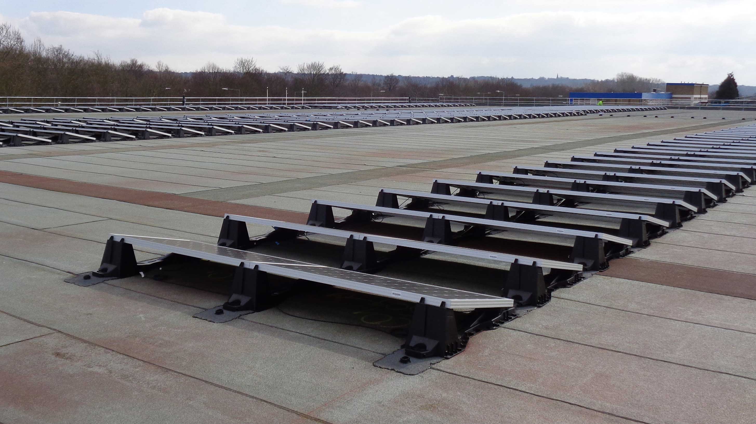 Rooftop with Array of solar panels installed on bauder reinforced bituminous waterproofing system