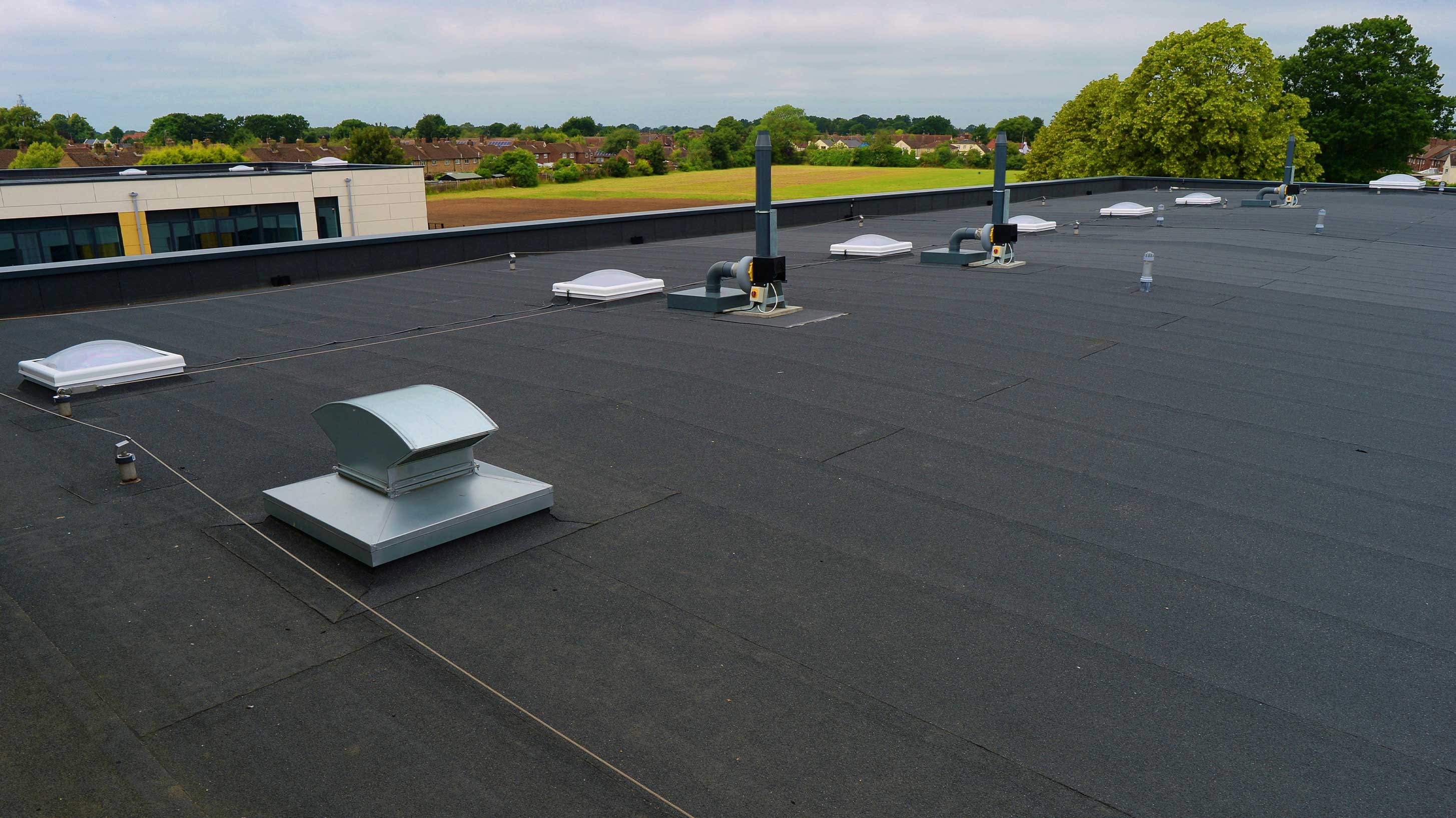 Paxman Avenue Secondary School with Bauderflex bituminous waterproofing system installed with Euroglaze rooflights