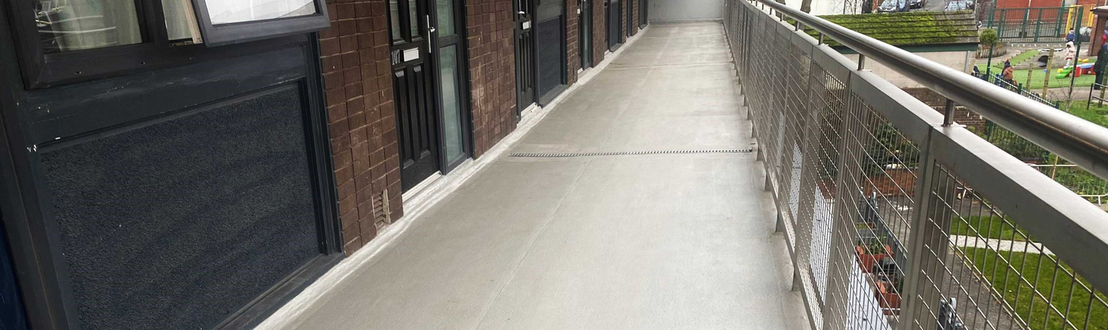 Cold applied liquid, PMMA resin waterproofing walkways to flats.