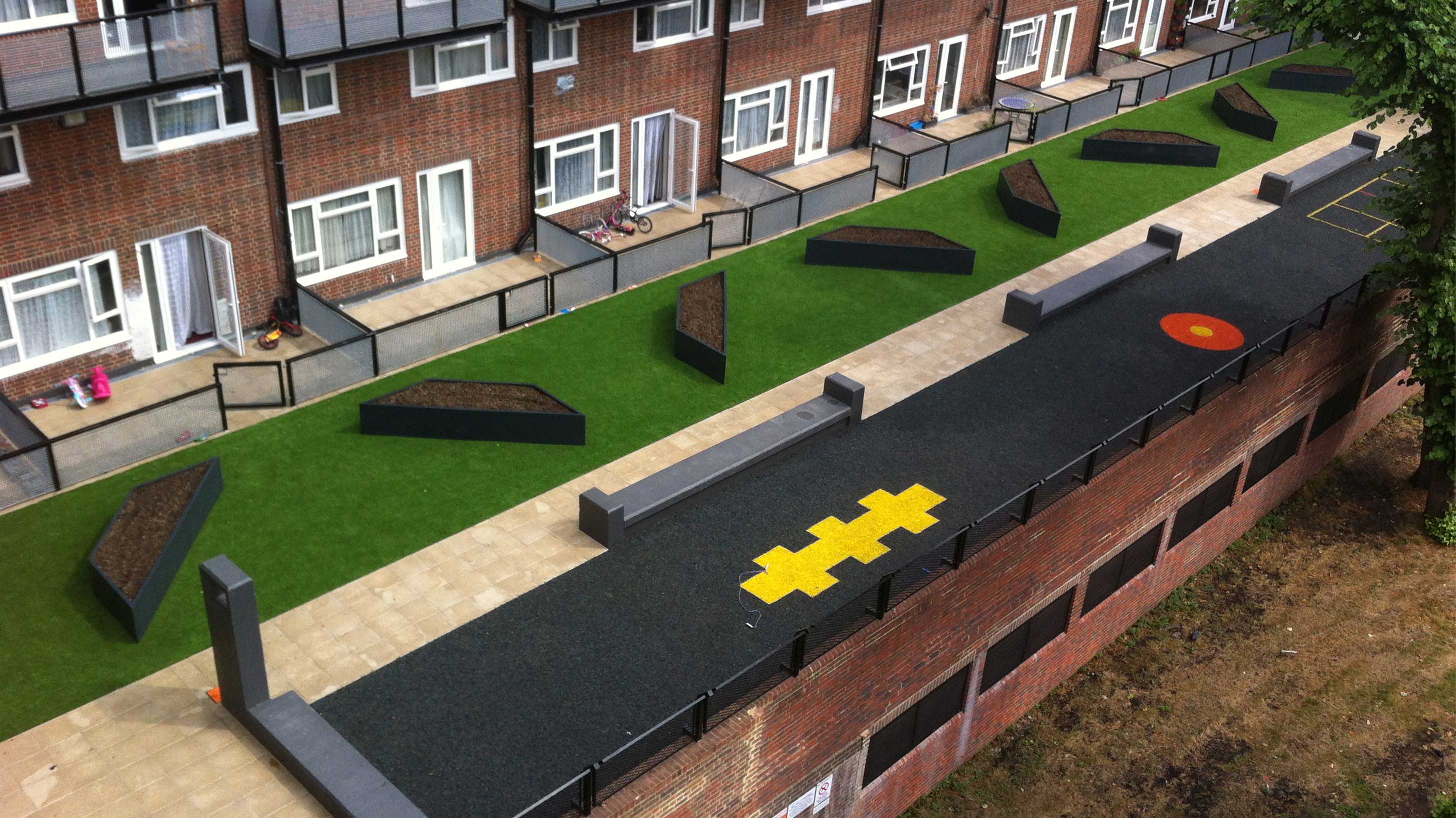 Permeable paving on the ground floor patios and walkways, artificial turf featuring fibreglass planters