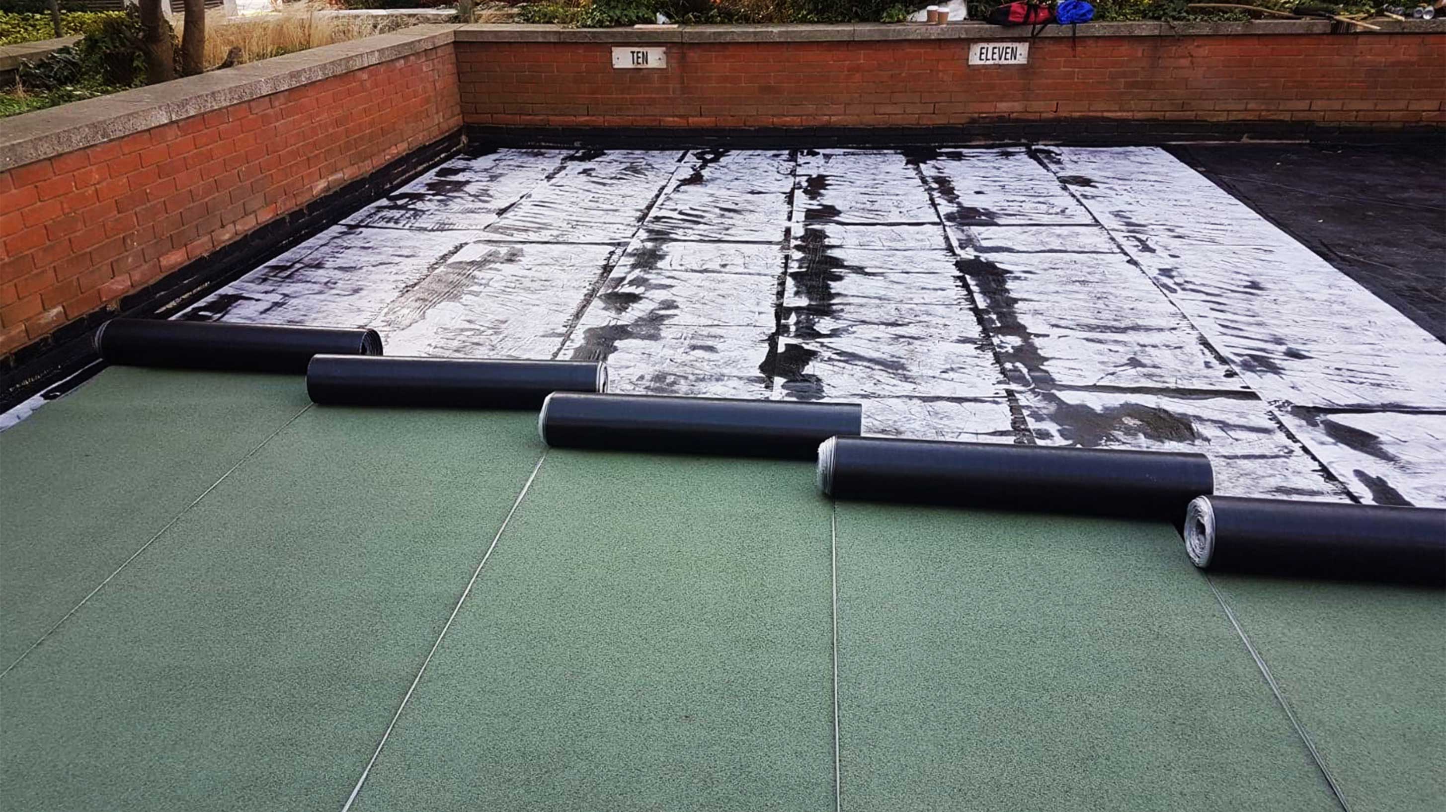 Bauder Bakor 790-11 hot melt structural waterproofing with intensive green roof being installed